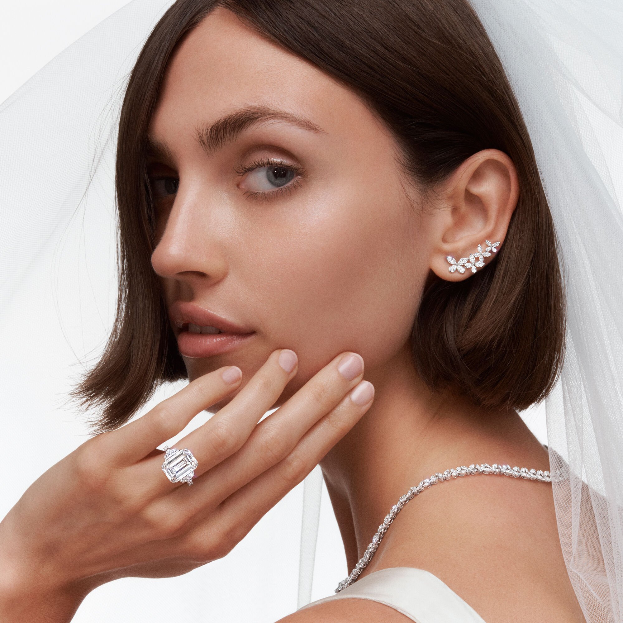 Model wears Graff Promise Emerald Cut Engagement Ring