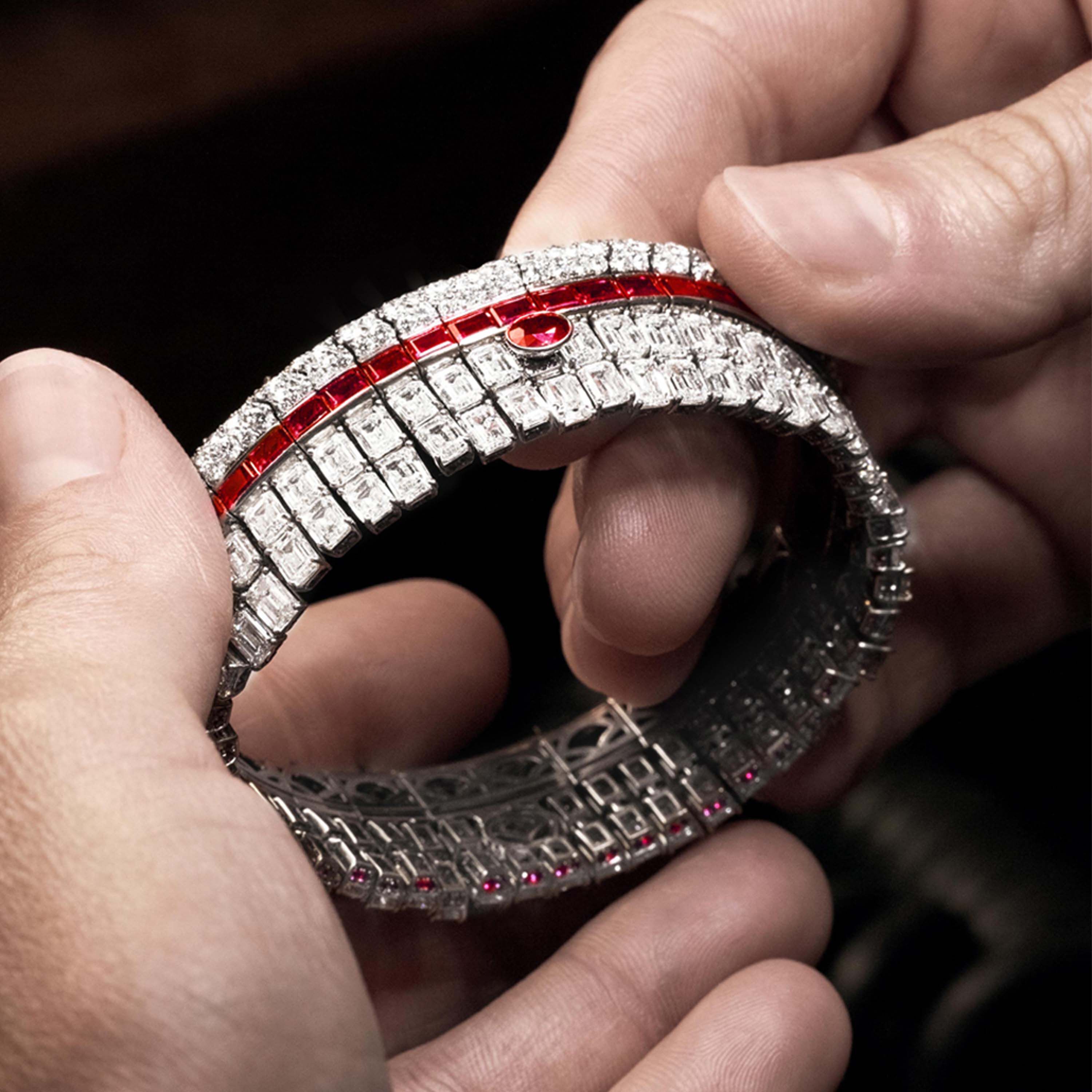 Image of Graff craftsman finishing Ruby and White Diamond High Jewellery bangle in Graff Workshop