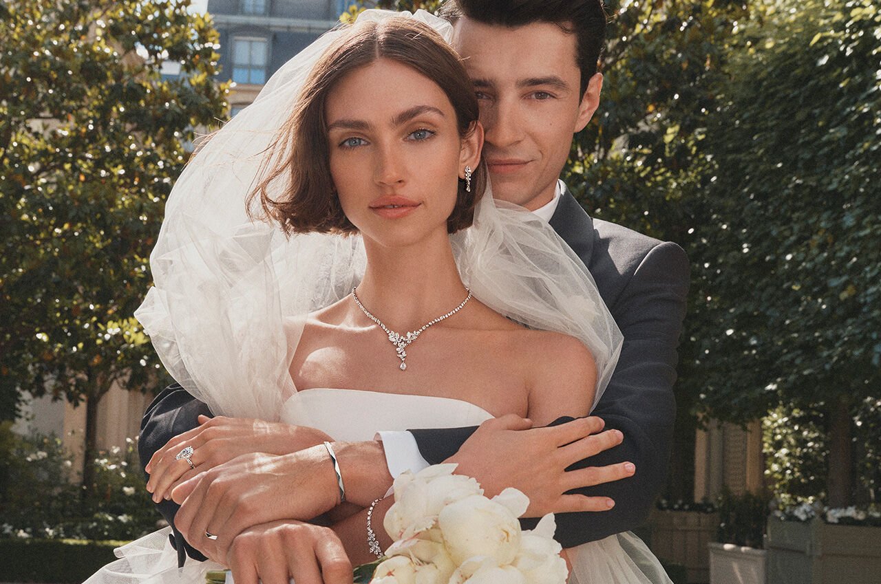 Female and male model wearing Graff Butterfly Bridal Jewellery, Graff Promise Engagement ring and Laurence Graff Signature collection Men's Jewellery