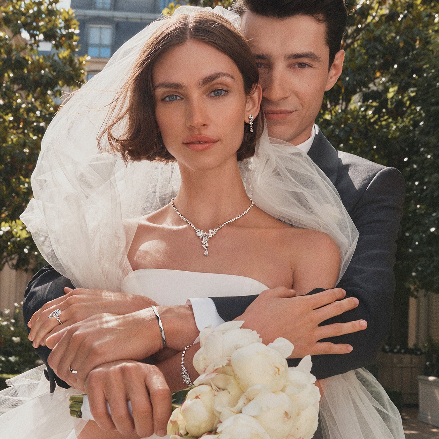 Female and Male model wear Graff Engagement Rings and Wedding Bands