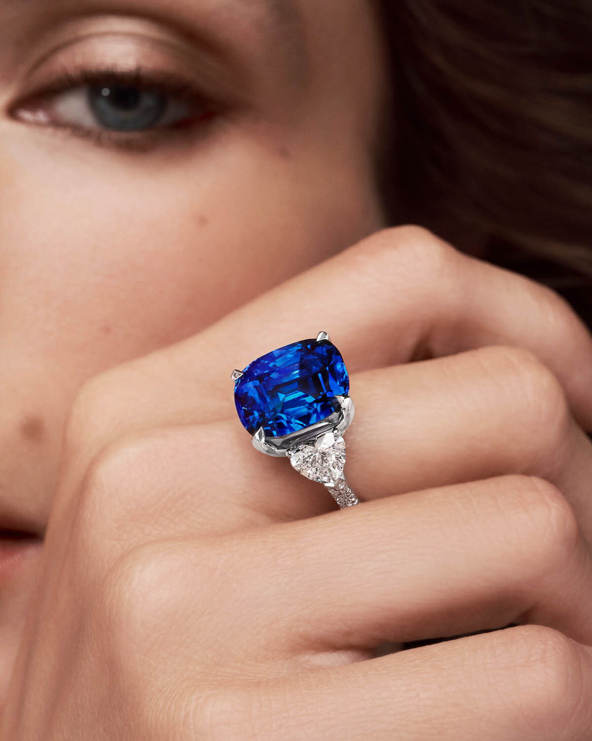 Unique Solitaires - model wears Sapphire and White Diamond solitaie ring