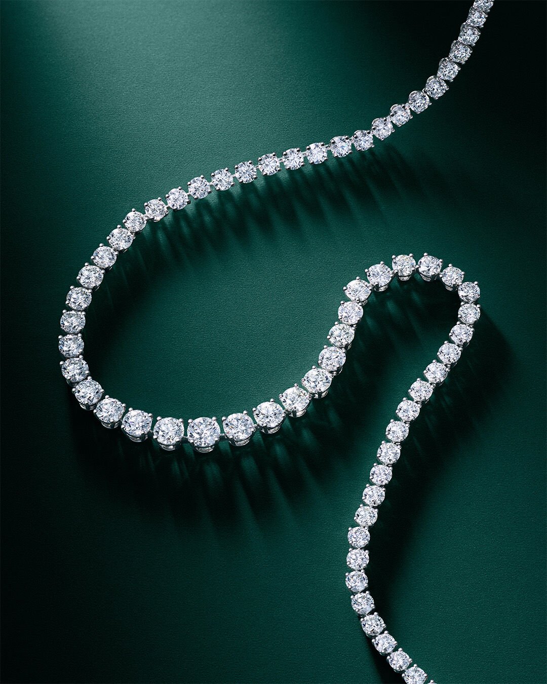 Image shows white diamond necklace 