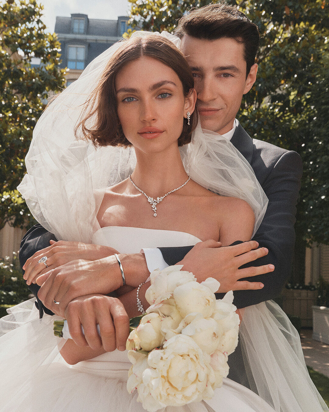 Female and male model wearing Graff Bridal Butterfly jewellery and Laurence Graff Signature collection